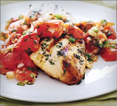 Grilled chicken and tomato based sauce with olive oil